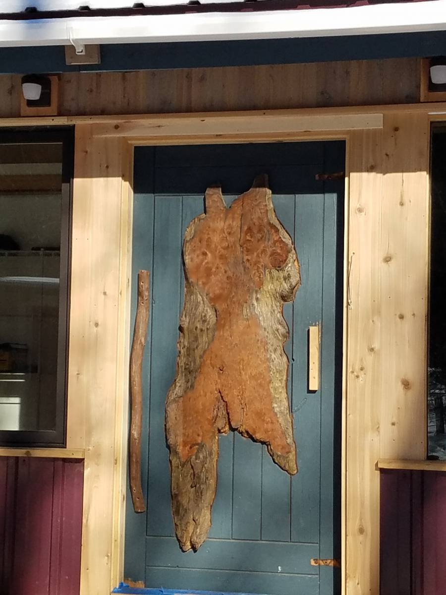 The original cabin door wood carving.